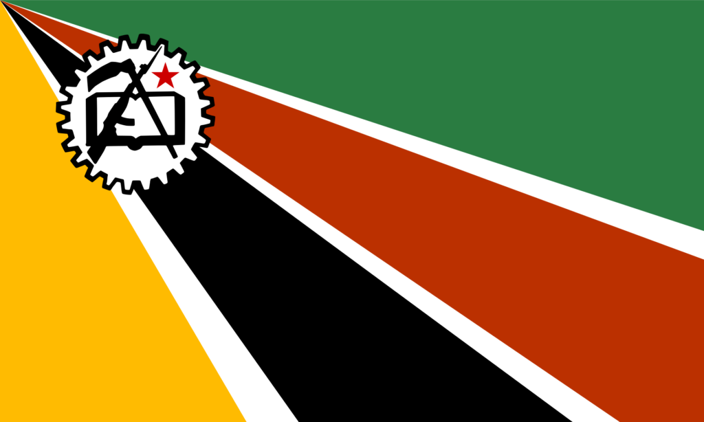 Historical flag of Mozambique with diagonal stripes in green, black, and yellow, and a red triangle featuring a white gear, open book, and rifle.