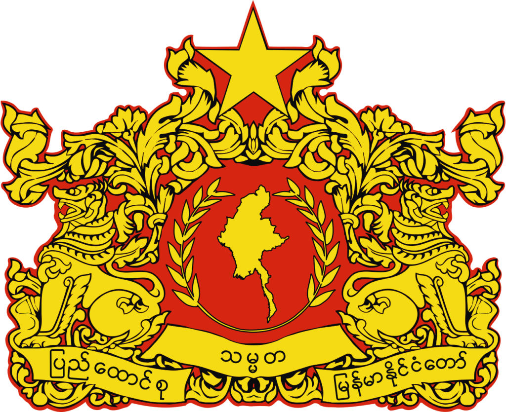 Emblem of Myanmar featuring a star above a map and traditional Burmese patterns in red and gold colors.