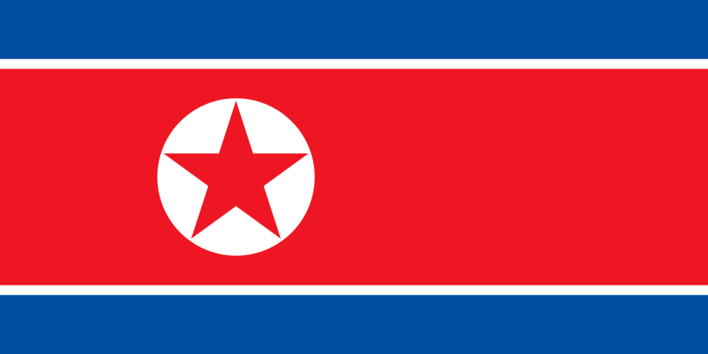 Flag of North Korea with a central red panel bordered by white and blue stripes and a white circle with a red star in the middle.