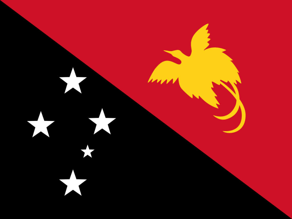 Flag of Papua New Guinea featuring a black diagonal stripe with five white stars on the left and a yellow bird-of-paradise on a red background on the right.