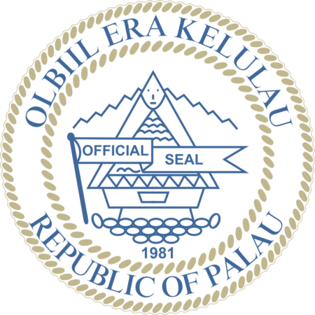 Official seal of the Republic of Palau featuring a traditional meeting house, ocean waves, and the text "Republic of Palau" in a circular border.