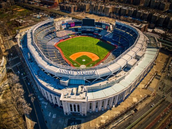 An aerial view of an empty Yankee Stadium on a sunny day.