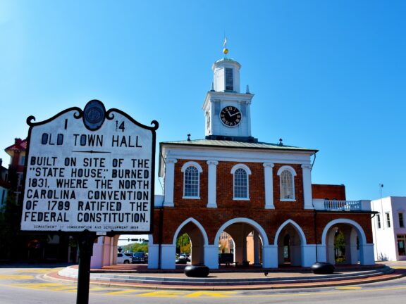 A street-level view of the Old Town Hall and historical marker in Fayetteville, Cumberland County.