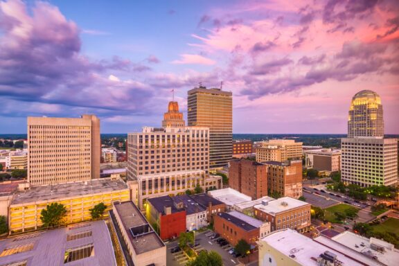 An aerial view of the Winston-Salem skyline at dusk in Forsyth County, North Carolina.