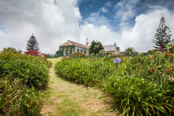 A French flag stands outside a small house on top of a hill on Saint Helena Island.