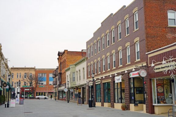 A street-level view of shop fronts in downtown Somerville, New Jersey.