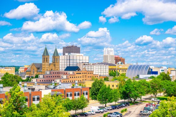 Akron, Ohio can be seen from a distance under a partly cloudy sky.    