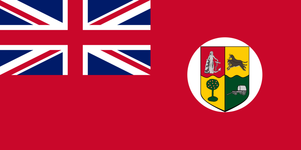 Flag of British South Africa with the Union Jack in the upper left corner and a shield with symbols on a red background on the right.