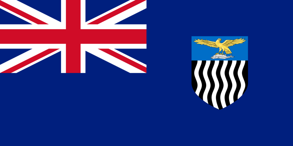 Flag of Northern Rhodesia featuring a British Union Jack in the top left corner and a shield with a black and white zebra pattern and an eagle on a blue background on the right.