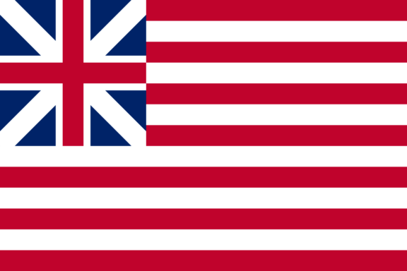 The Grand Union Flag with a British Union Jack in the upper left corner and thirteen alternating red and white stripes.