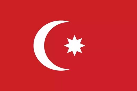 Red flag with a white crescent moon and an eight-pointed star.