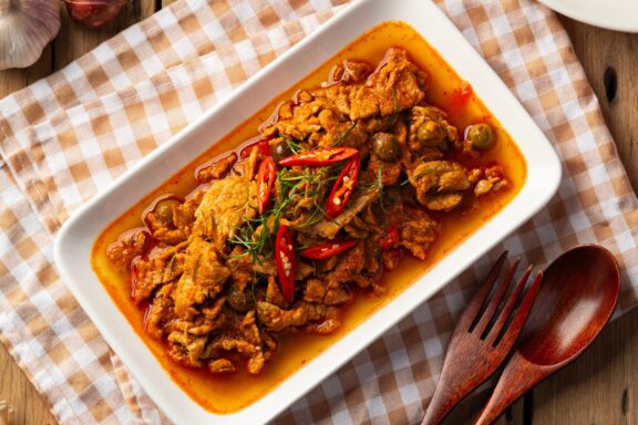 Panang Curry with Pork.Sliced Meat in red curry paste and coconut milk.