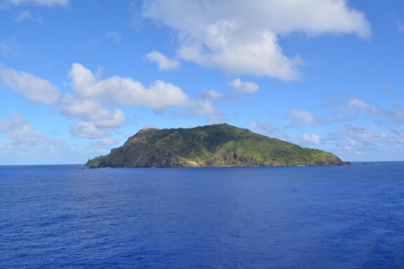 Pitcairn Island is surrounded by blue seas.