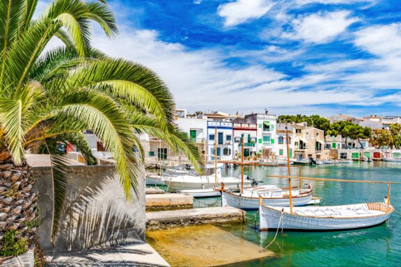 Portocolom's harbor, a serene embrace of water and time