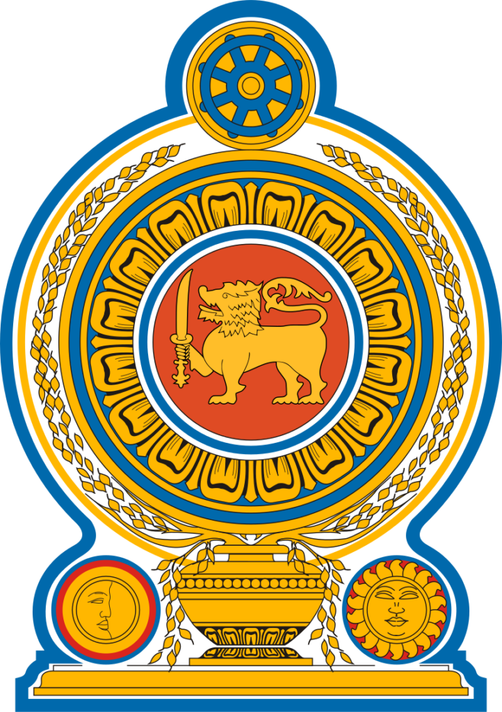 Coat of arms of Sri Lanka featuring a golden lion holding a sword in the center, surrounded by a blue and gold circular motif with a Dharmachakra at the top, flanked by two images of the sun and the moon.