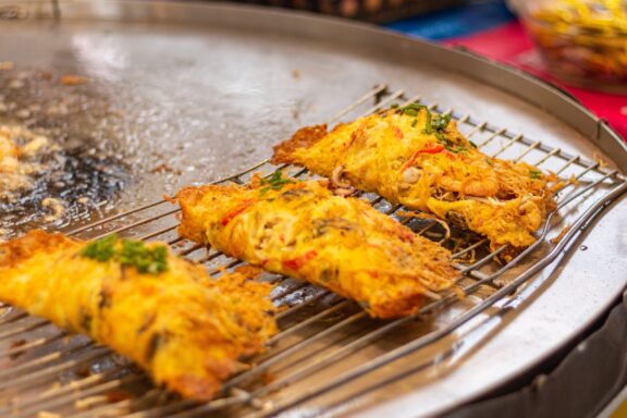 Thai street food hoi tod crispy pan fried mussels with