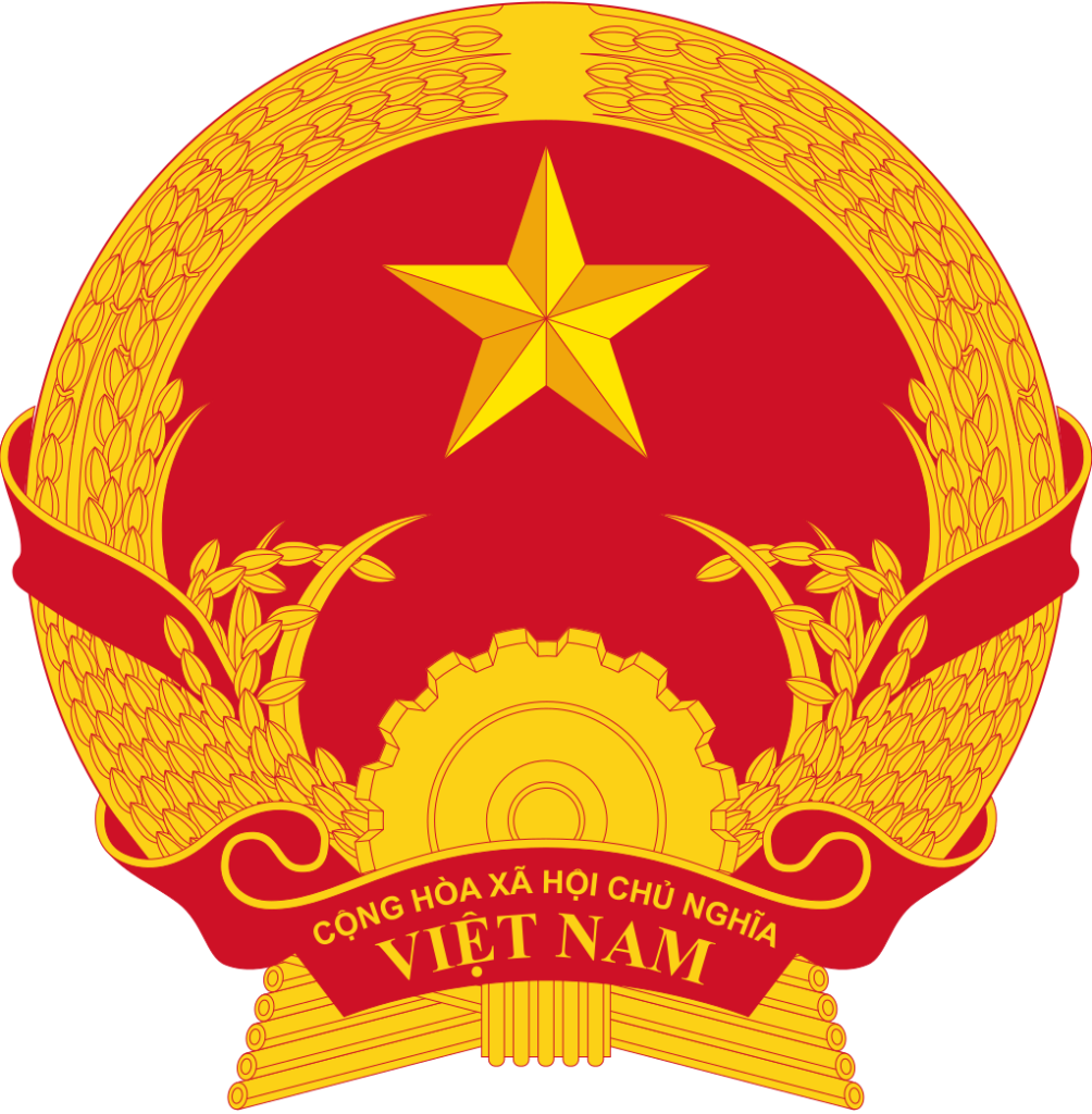 Emblem of Vietnam featuring a gold star centered on a red background, encircled by rice sheaves, cogwheel, and text.