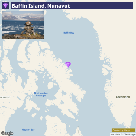 A map highlighting Baffin Island in Nunavut, with an inset picture of an inuksuk (stone landmark or cairn) overlooking the water. The map shows surrounding geographic features, including Baffin Bay, Greenland, the Northwestern Passages, and Hudson Bay.