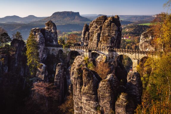 Bastei Bridge Amidst Rock Formations Basteibrücke's natural bridge during sunrise