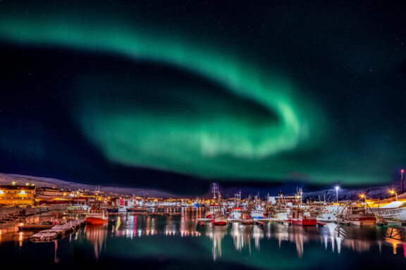 Båtsfjord's frontier, where the midnight sun illuminates the rugged Arctic wilderness