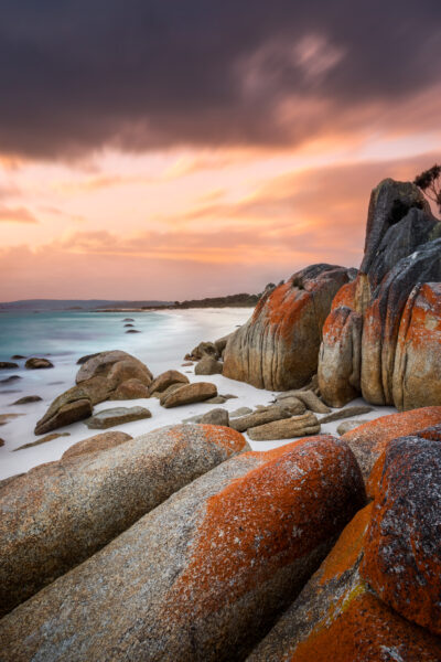 Binalong Bay's fiery lichen-covered rocks