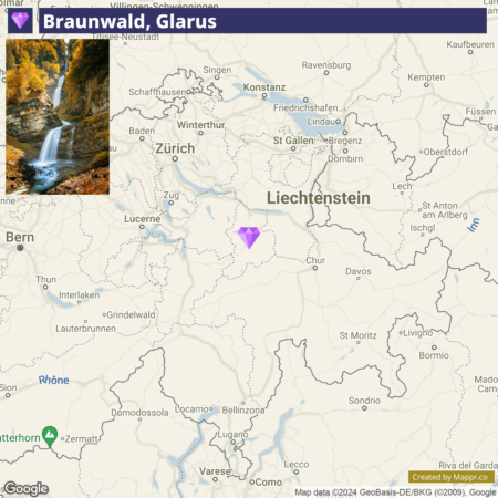 Map showing a region in central Europe with the location of Braunwald, Glarus marked with a purple pin. Insets on the map include a picture of a waterfall in a forested area, and various cities such as Zurich, Lucerne, and Bern are visible. There are geographical features like rivers and mountains indicated, as well as neighboring countries like Liechtenstein.