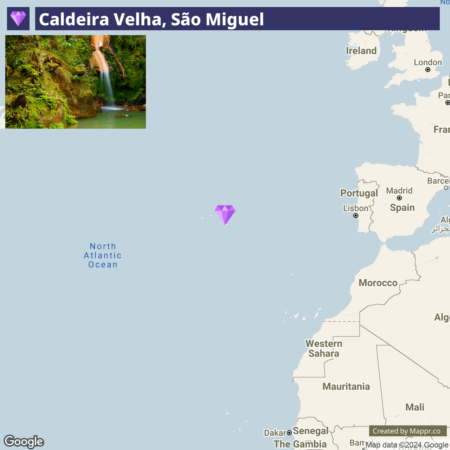 A map location pin indicating Caldeira Velha, São Miguel, with a partial map of the surrounding Atlantic Ocean and nearby countries. The top portion of the image shows a lush waterfall scene at Caldeira Velha.