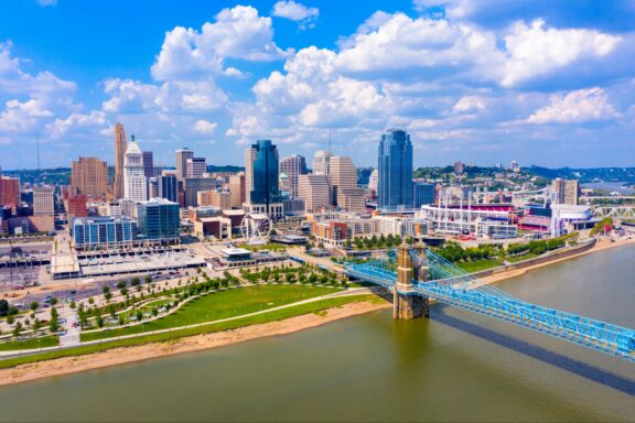 Cincinnati, Ohio Skyline and Riverfront Cincinnati ohio skyline with john roebling bridge aerial view