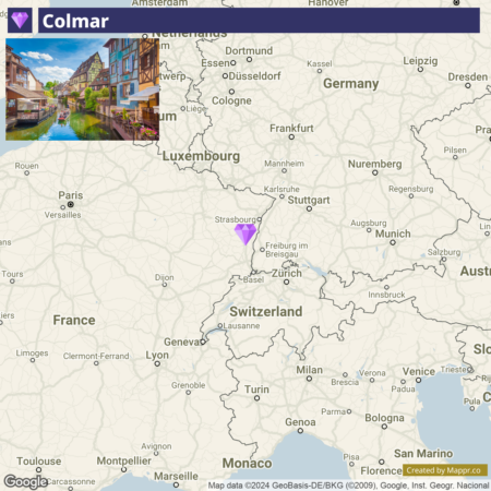 A digital composite map showing Colmar with an inset image of traditional half-timbered houses along a canal, positioned over Western Europe with prominent labels for major cities and countries. A purple pin marks Colmar's location near the border of France and Germany.