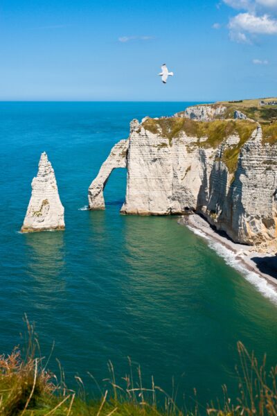 Étretat, famous for its towering chalk cliffs and natural arches