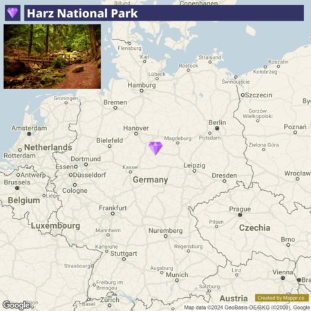 Map featuring a highlighted area for Harz National Park in Germany, with an inset image showing a forest path within the park. The map also shows surrounding countries and major cities.