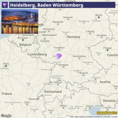 A map highlighting the location of Heidelberg in the state of Baden-Württemberg, Germany, with a purple marker, and an inset night-time image of the city's lit-up riverside architecture.