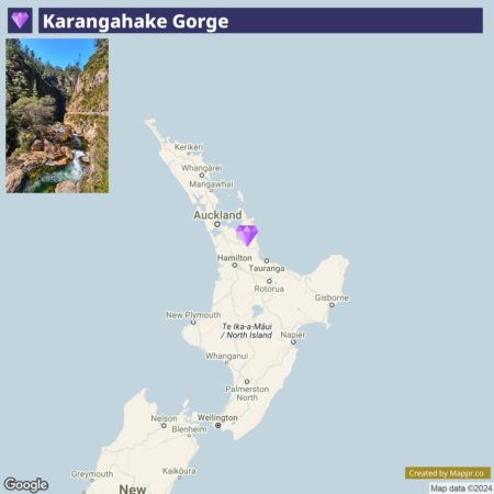 An image showing a small photograph of Karangahake Gorge in the upper left corner, overlaid on a map of the northern part of New Zealand's North Island. The location of the gorge is indicated with a purple marker near Auckland. The image includes map annotations from Google and a credit to Mappr.co.