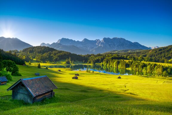 Serene Lake Geroldsee with Alpine Mountains in the Background Lake Geroldsee's tranquil waters and alpine serenity