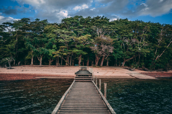 Lake Hauroko's dark waters set against Fiordland's ancient forests