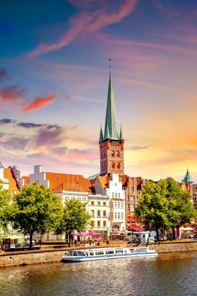 Lübeck Waterfront and Church Spire at Sunset Lübeck, the 'Queen of the Hanseatic League'