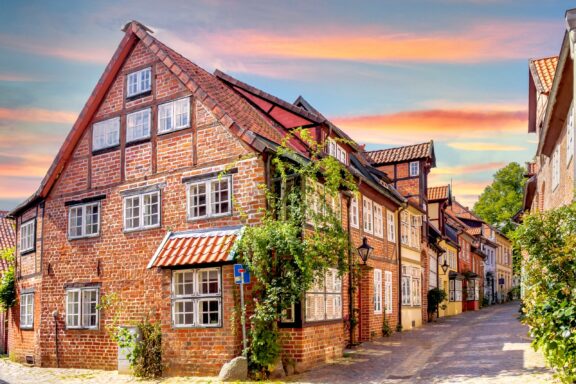 Quaint Street in Lüneburg at Sunset Lüneburg, showcasing the wealth and heritage of a bygone era in Lower Saxony