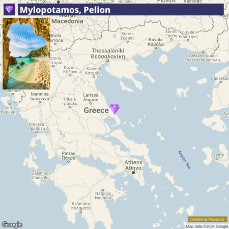 A map of Greece highlighting Mylopotamos, Pelion with a small inset picture of a rocky opening framing a view of a beach with turquoise water.