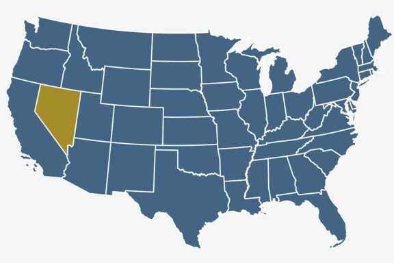 A simplified map of the United States highlighting the state of Nevada in gold color, with other states in blue, and state boundaries outlined in white.