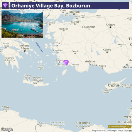 A map displaying Orhaniye Village Bay in Bozburun, Turkey, with surrounding locations including Marmaris, Bodrum, Fethiye, and larger cities like Izmir and Ankara in the broader region. Athens and parts of Cyprus are also visible, along with the Aegean Sea to the west.