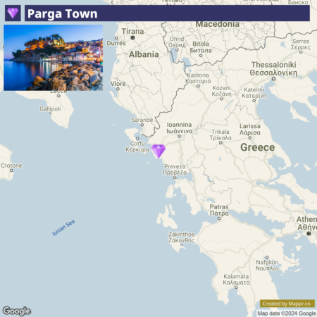 A map featuring the location of Parga Town with a purple pointer, adjacent to an inset photograph of Parga Town at night showcasing lit buildings along the coast.