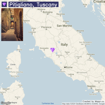 A map of a section of Italy highlighting the location of Pitigliano, Tuscany, with a marker and inset image showing an atmospheric alleyway within the town.