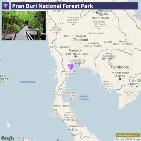 A map showing the location of Pran Buri National Forest Park in Thailand, marked by a purple tree icon in Prachuap Khiri Khan province, south of Bangkok and near the Gulf of Thailand. The map includes neighboring country Cambodia and nearby geographic labels such as Bangkok, Pattaya City, and the Andaman Sea. There is also a small inset image in the upper left corner showcasing a wooden walkway through a lush forest within the park.