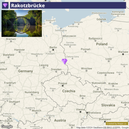 A map showing the location of Rakotzbrücke with a purple pointer in eastern Germany, near the border with Poland. Inset at the top left corner of the map is a photo of the Rakotzbrücke, a stone arch bridge reflected in the tranquil waters below, surrounded by green foliage.