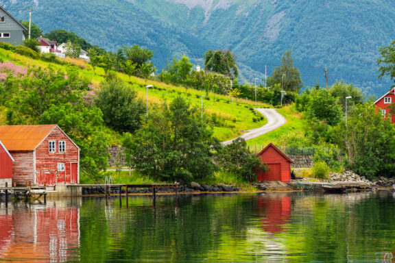 Rosendal, surrounded by mountains and fjords, with a historic manor as its centerpiece