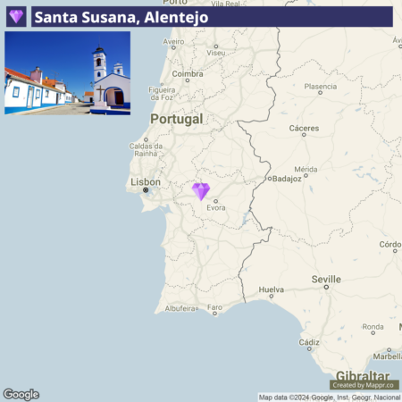 An image showing a map section of Portugal with a marked location named Santa Susana, Alentejo, which is highlighted with a purple diamond symbol, showing its position relative to Lisbon, Évora, and other nearby Portuguese cities. The top left corner of the image features a photograph of a sunny street with traditional white houses and a blue church with a bell tower in a place identified as Santa Susana, Alentejo.