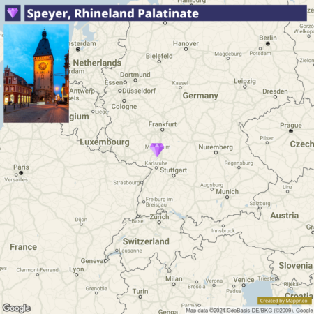 A map overlay with a photo of Speyer, Rhineland Palatinate, featuring the Old Gate (Altpörtel) at twilight, above a portion of a map showing the location of Speyer in southwestern Germany, with nearby countries and major cities labeled.