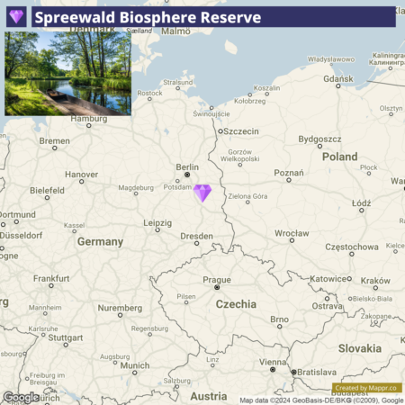 A map showing the location of Spreewald Biosphere Reserve in Germany, with an overlaid image of a serene waterway and lush greenery within the reserve.