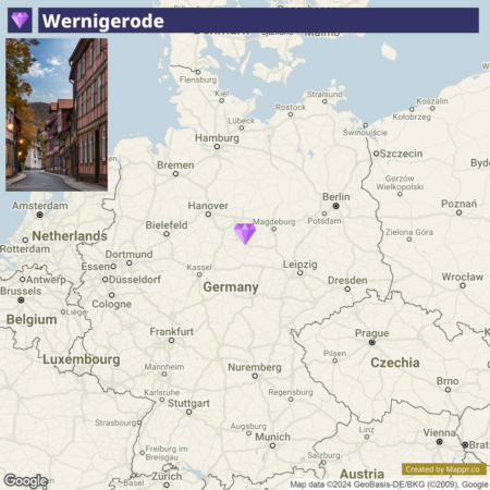 A map showing the location of Wernigerode in Germany, with a purple diamond marker around the center of the country, slightly to the northeast. The map displays major surrounding cities and borders of neighboring countries.