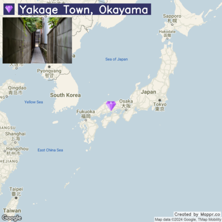 A map highlighting Yakage Town in Okayama, Japan, with a superimposed image of a narrow alleyway lined with high wooden walls on the left half, and the Google map of East Asia showing Japan and neighboring countries on the right half. The map includes city names and bodies of water, with a diamond-shaped icon marking Yakage Town's location.